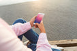 Free Smartphone Mockup With Woman At The Beach Psd