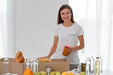 Free Smiley Female Volunteer Preparing Food For Donation Psd