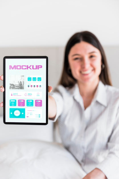 Free Smiley Woman Holding Tablet With Mock-Up Psd