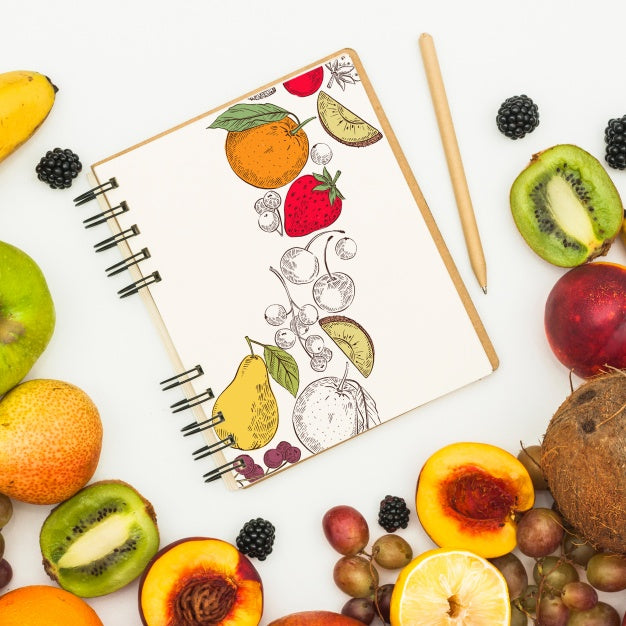 Free Spiral Notebook Mockup With Fruits Psd