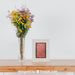 Free Spring Mockup With Vertical Frame And Vase Of Flowers Psd