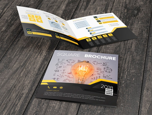 Free Square Brochure Mockup On Wooden Surface Psd