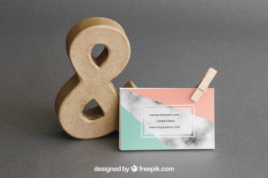 Free Stationery Mockup With Business Card Leaning Against Ampersand Psd