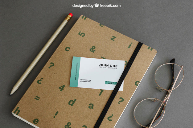 Free Stationery Mockup With Business Card On Book Psd