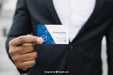 Free Stylish Businessman Holding Business Card Mockup Psd