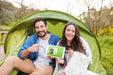 Free Summer Camp Mockup With Couple Pointing At Tablet Psd