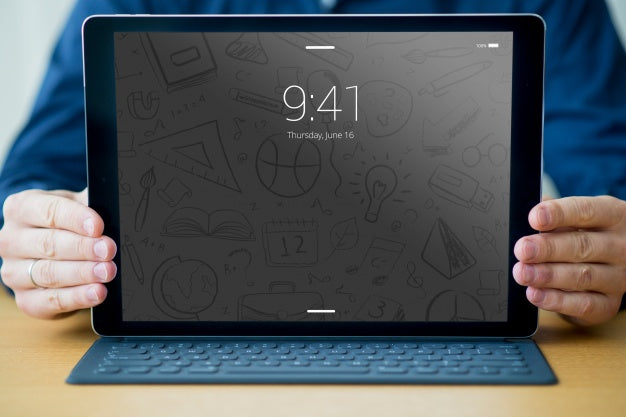 Free Tablet Mockup With Keyboard And Man Psd