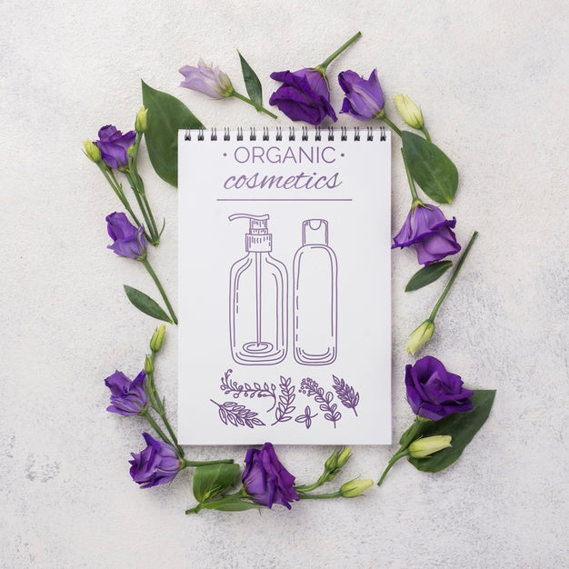 Free Top View Cosmetics Mockup With Flowers Psd