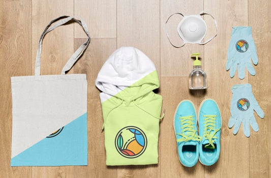 Free Top View Folded Hoodies Mock-Up With Bag And Shoes Psd