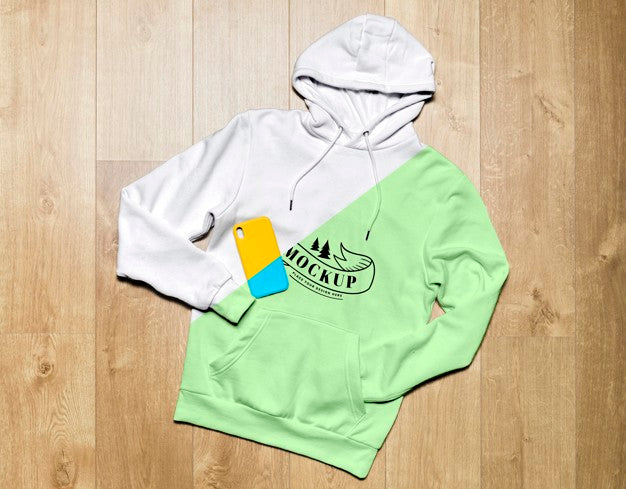 Free Top View Green Hoodie Mock-Up With Phone Case Psd