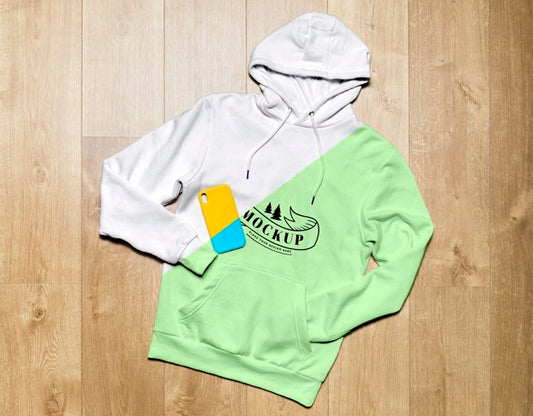 Free Top View Green Hoodie Mock-Up With Phone Case Psd