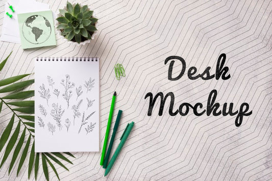 Free Top View Notebook Mock-Up And Stationery Near Plant Psd