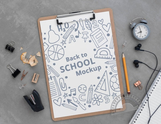 Free Top View Of Clip Pad With School Supplies Psd