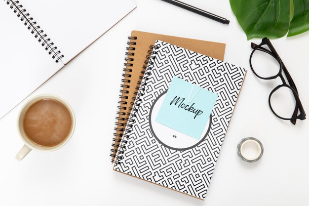Free Top View Of Desk Surface With Noteboks Psd