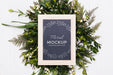 Free Top View Of Frame Mock-Up With Vegetation Wreath Psd