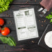 Free Top View Of Menu With Cutlery And Tomatoes Psd