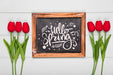 Free Top View Of Spring Red Tulips And Blackboard Psd