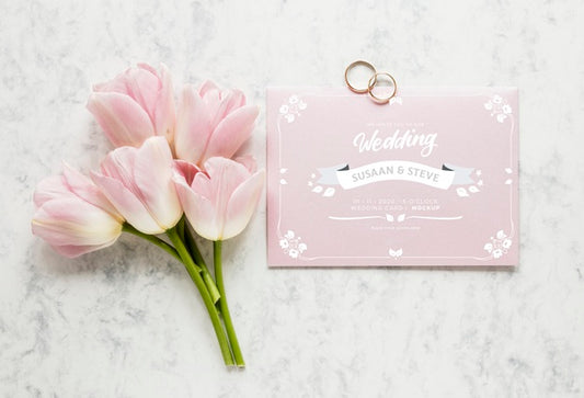 Free Top View Of Wedding Card With Bouquet Of Tulips And Rings Psd