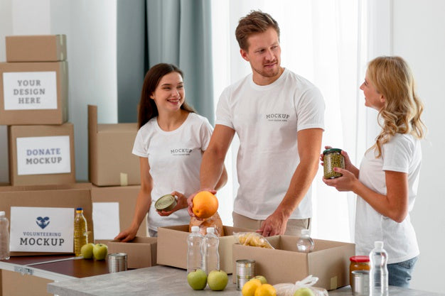 Free Volunteers Preparing Food In Boxes For Donation Psd
