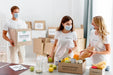 Free Volunteers With Medical Masks Preparing Provision Boxes For Donation Psd