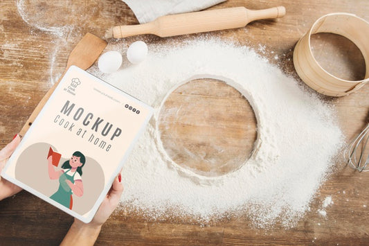 Free Woman Holding Book In The Kitchen With Flour And Sieve Psd