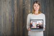 Free Woman Holding Laptop Mockup Psd