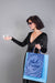 Free Woman Holding Shopping Bag Mockup With Black Friday Concept Psd