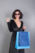 Free Woman Holding Shopping Bag Mockup With Black Friday Concept Psd