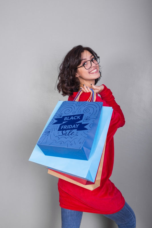 Free Woman Holding Shopping Bag Mockup With Black Friday Concept Psd