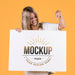 Free Woman Holding Sign Mock-Up Psd
