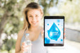 Free Woman Presenting Tablet Mockup With Water Concept Psd