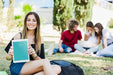 Free Woman Showing Tablet Mockup In Park Psd