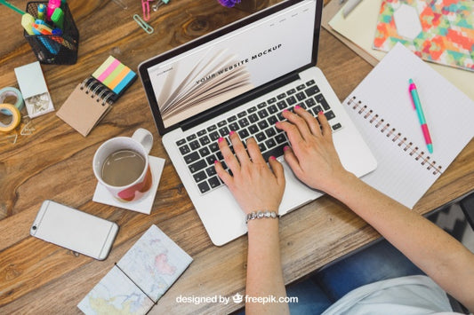 Free Woman Typing On Laptop Sitting At A Desk Psd