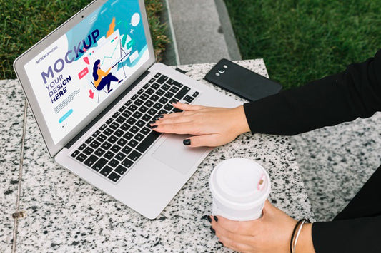 Free Woman Working On Laptop Outdoors Mock-Up Psd