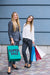 Free Women With Shopping Bags In City Psd