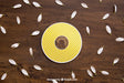 Free Yellow Cd Mockup With Petals Psd