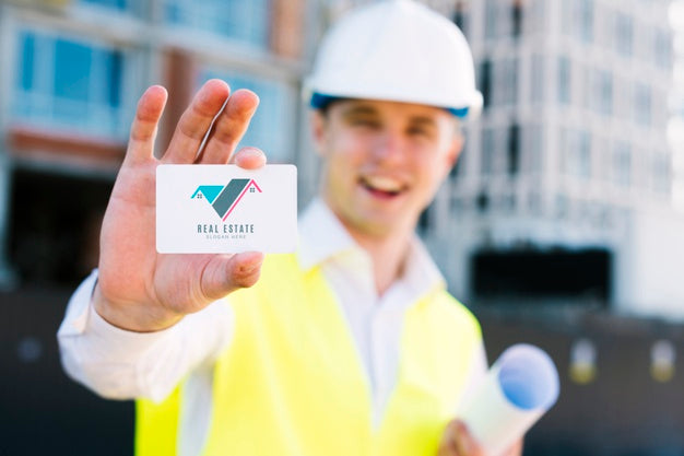 Free Young Architect Holding A Business Card Psd