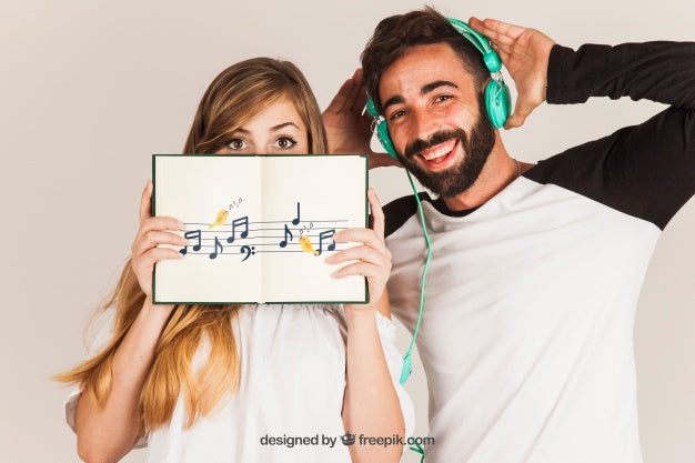 Free Young Couple Showing Book Psd