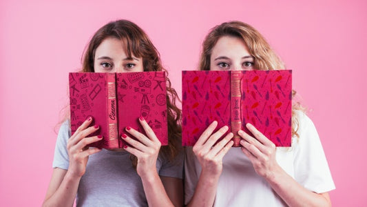Free Young Girls Holding Book Cover Mockup Psd