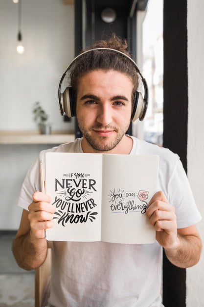 Free Young Man With A Open Book Mockup Psd